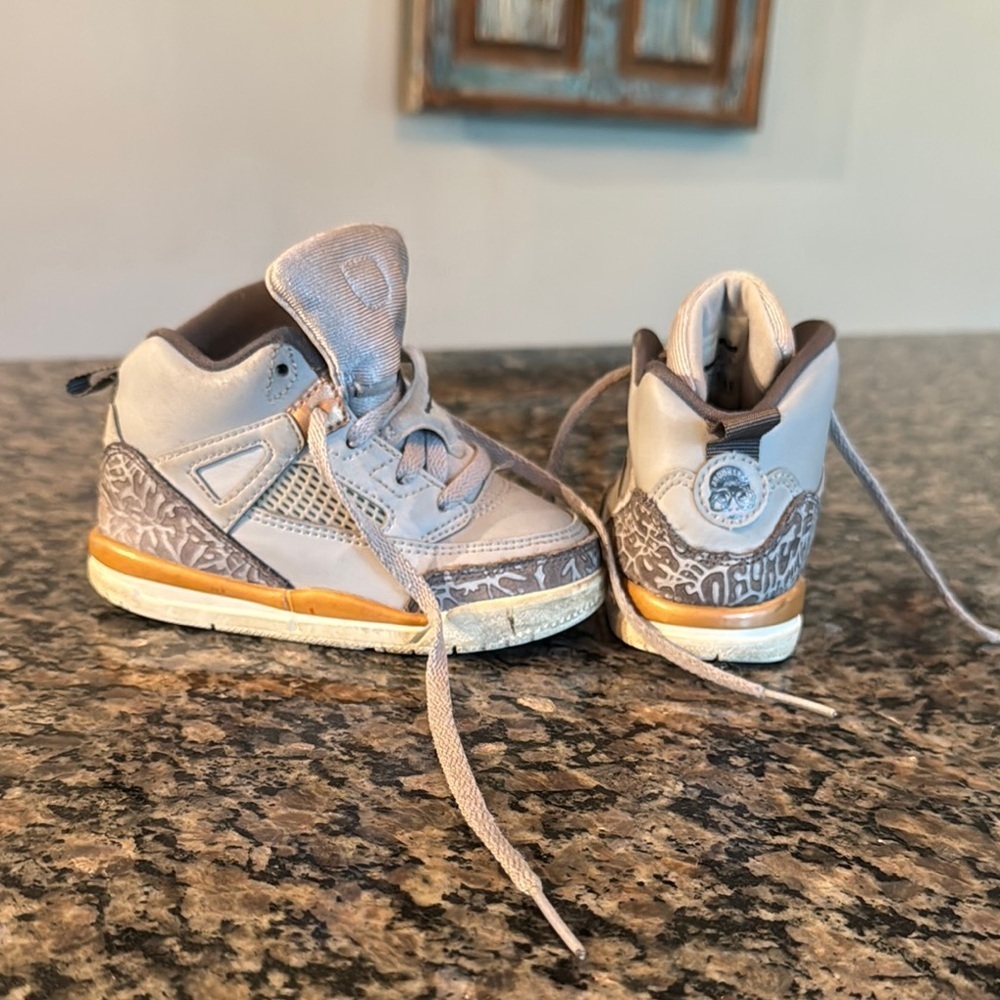 Jordan Gray and gold High-Top Sneakers 7C